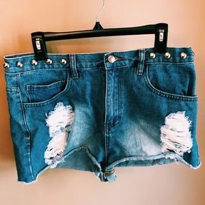Destroyed and studded jean shorts